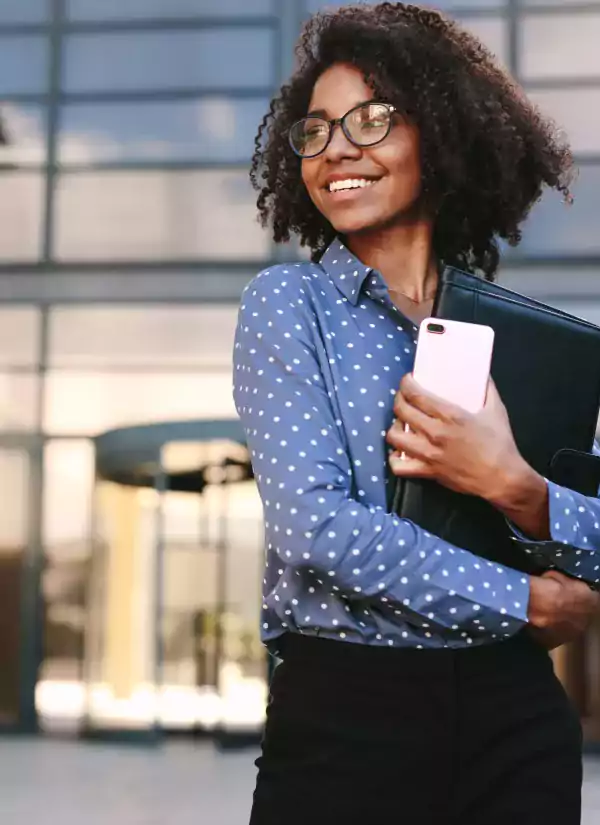 Woman with cellphone and portfolio