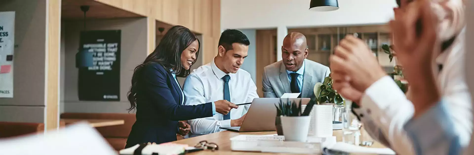 people collaborating at a work desk