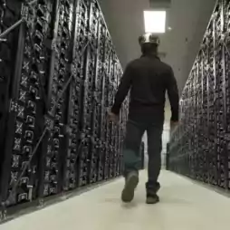 Worker walking through storage facility