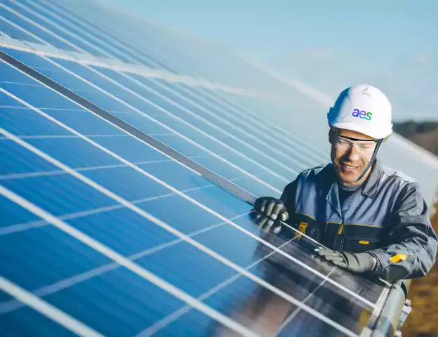 Man working on solar panel