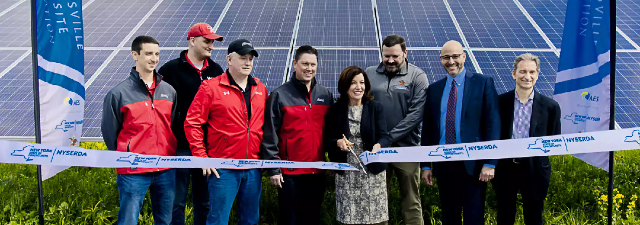 people cutting ribbon