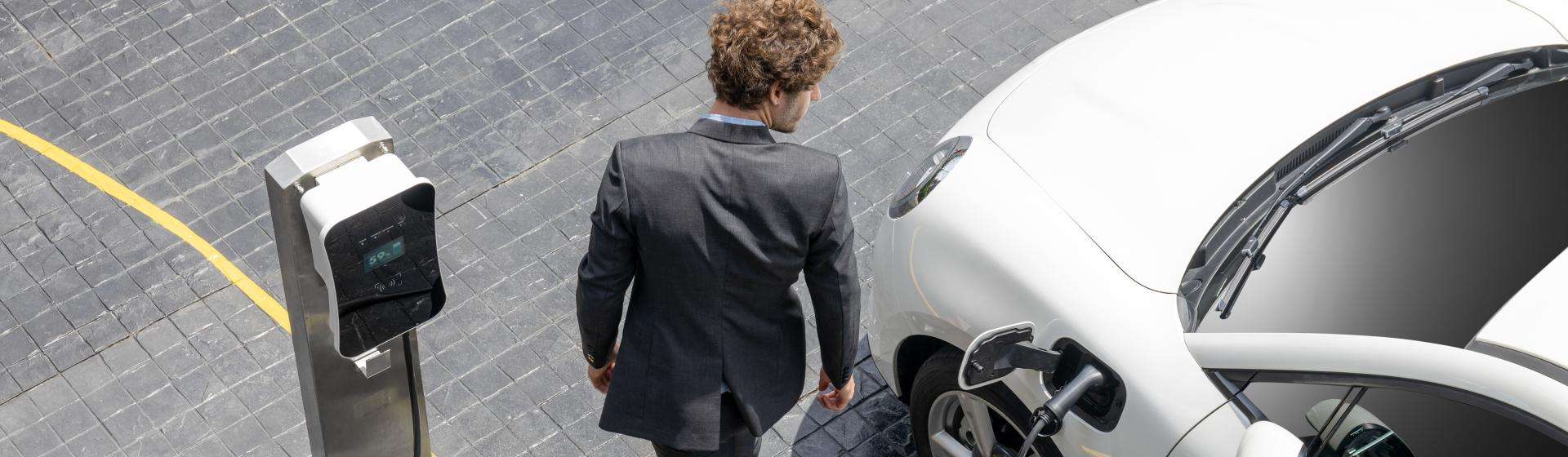 man charging car