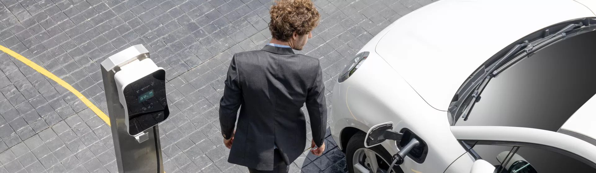 man charging car
