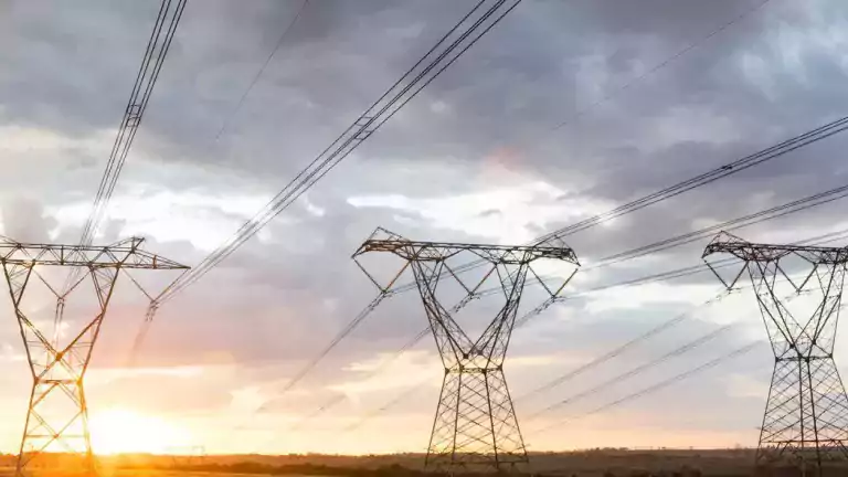 tech - 3 electric towers at sunset