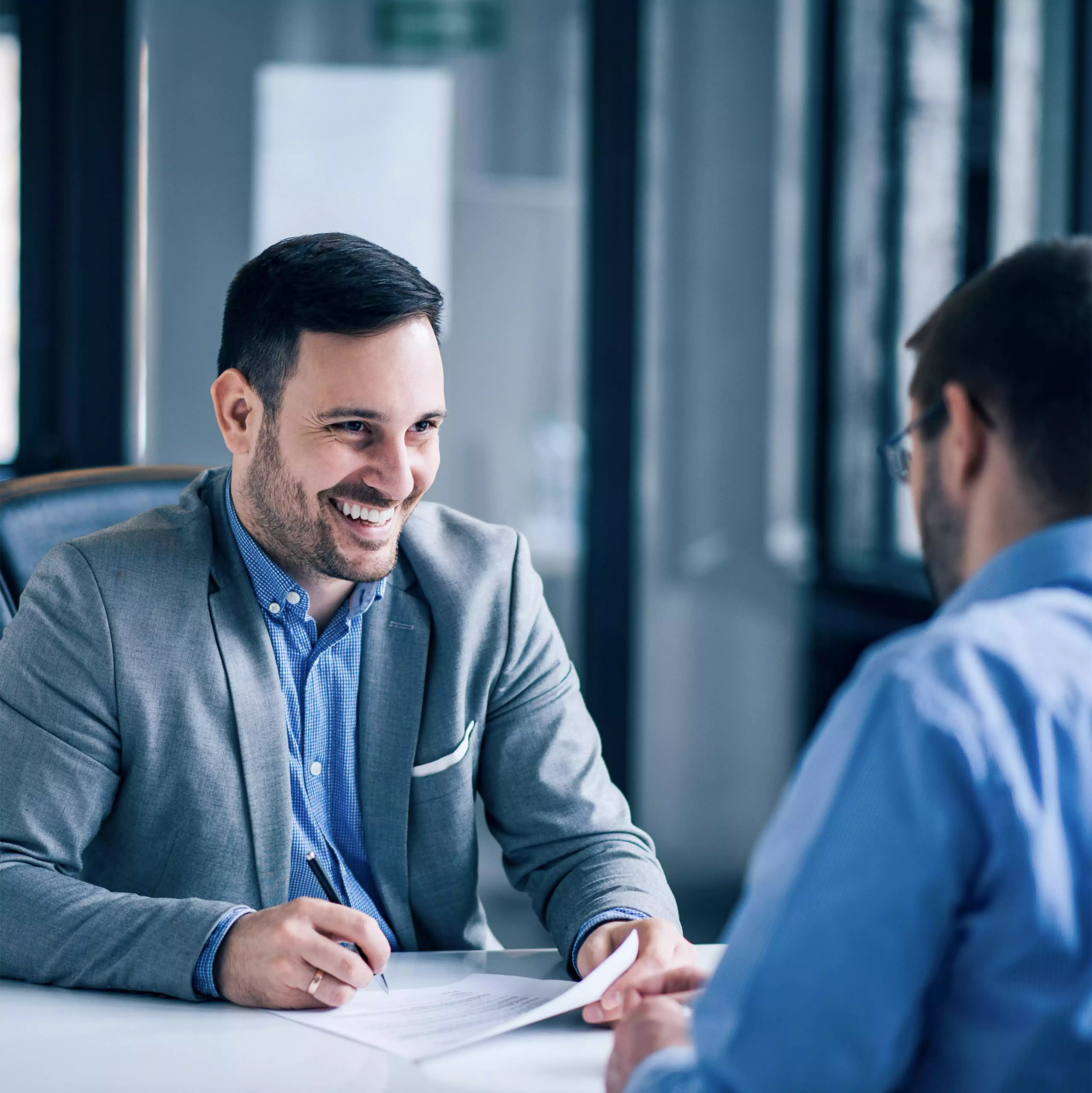 two men talking in office PNG