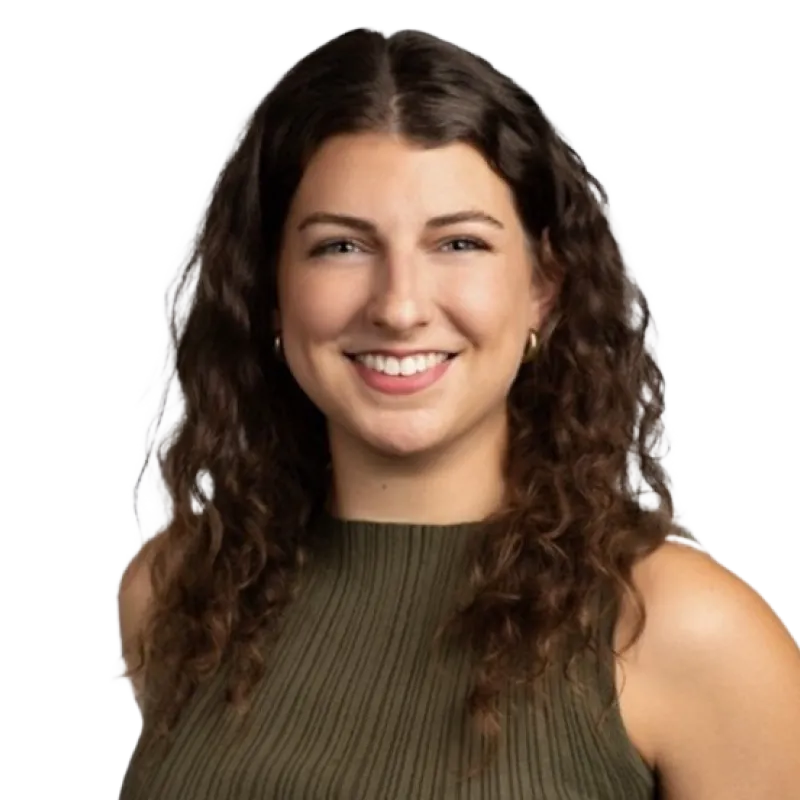 A professional portrait of Holly Keifer, featuring her smiling in a sleeveless green top with a neutral background.