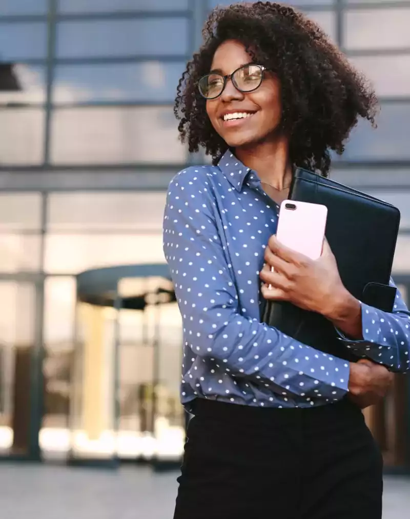 Woman with cellphone and portfolio