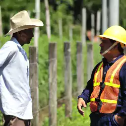 rural man talks with energy company