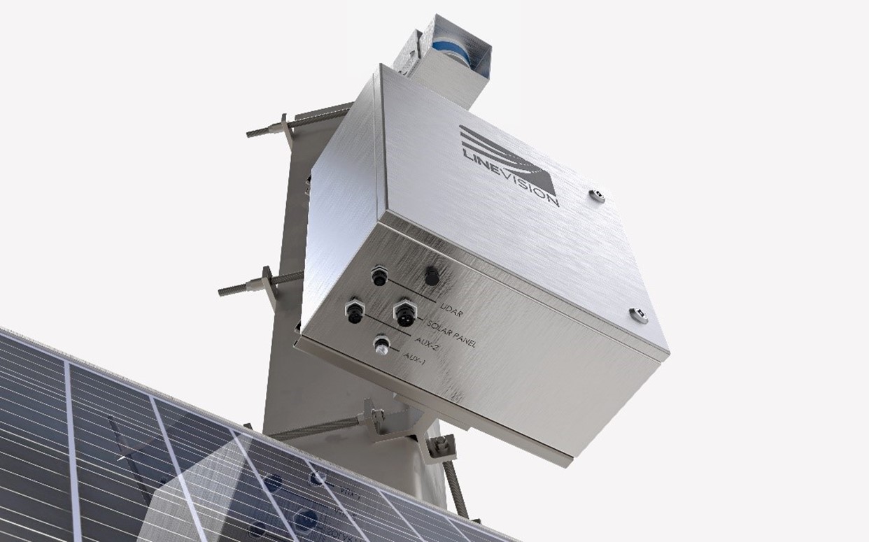 Close-up view of a metallic device labeled 'Line Vision' mounted on a structure with solar panels. The device has ports labeled LIDAR, Solar Panel, AUX-1, and AUX-2.