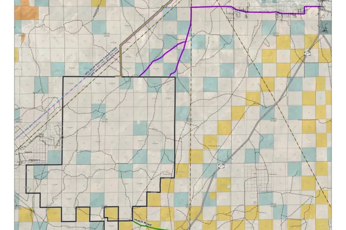 Map showing the West Camp Wind Farm in Navajo County, Arizona. The map includes highways, such as I-40, and locations like Joseph City and Holbrook. Colored grids indicate land sections, with a black outline marking the wind farm area. A purple line represents a power line route, and green labels indicate roads, including Hutch Road.
