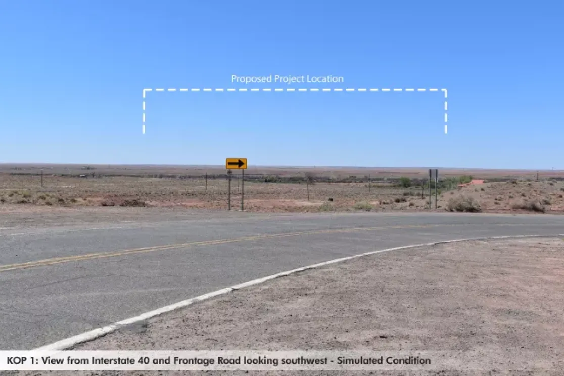 A desert landscape viewed from a road intersection with a directional arrow sign pointing left. The sky is clear blue. A dashed line labeled 'Proposed Project Location' is drawn in the sky, indicating a future development area.