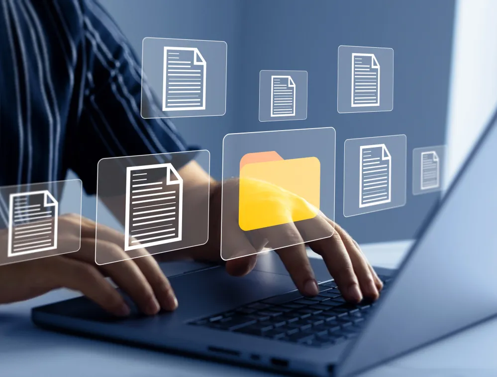 Person using a laptop while digital document and folder icons appear on screen, illustrating electronic file management, document organization, and digital record storage.