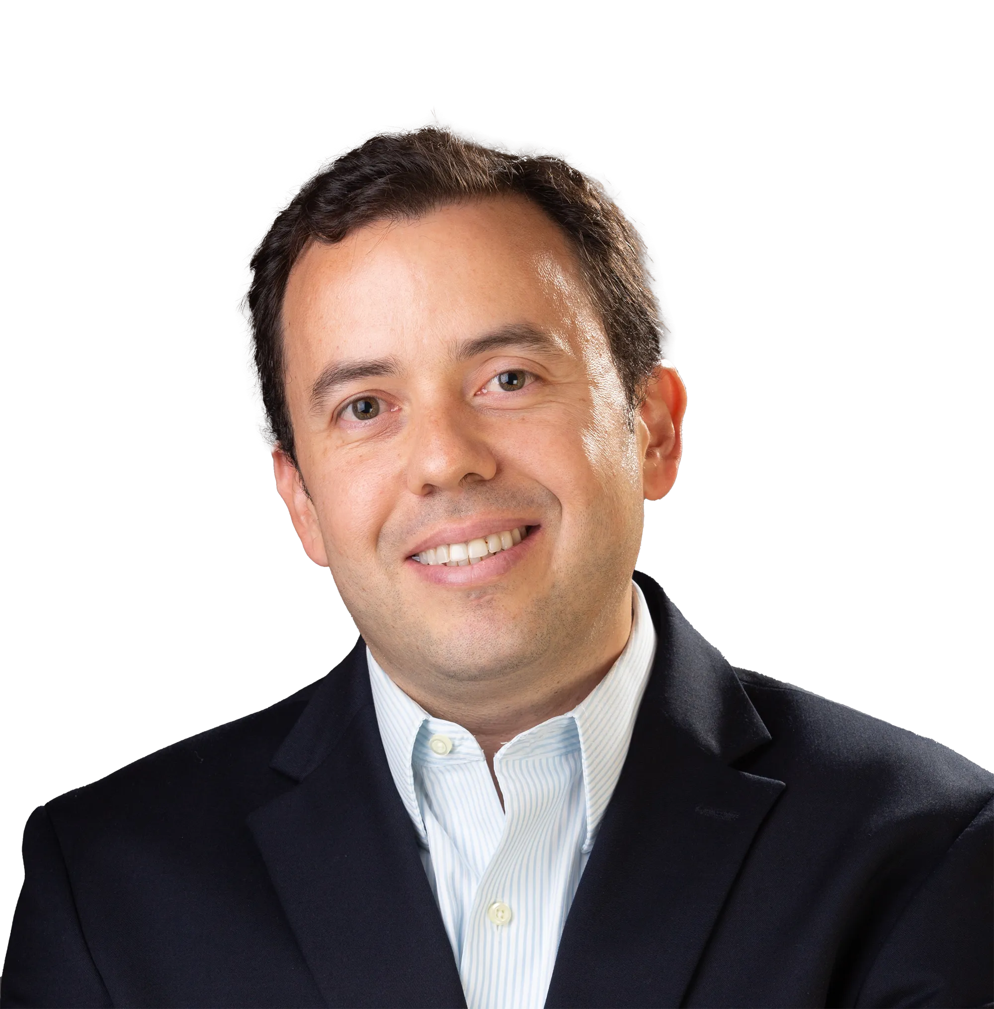 A smiling man with short dark hair, wearing a navy blue suit jacket and a light blue and white striped dress shirt.
