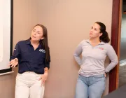Photo of two women giving a presentation.